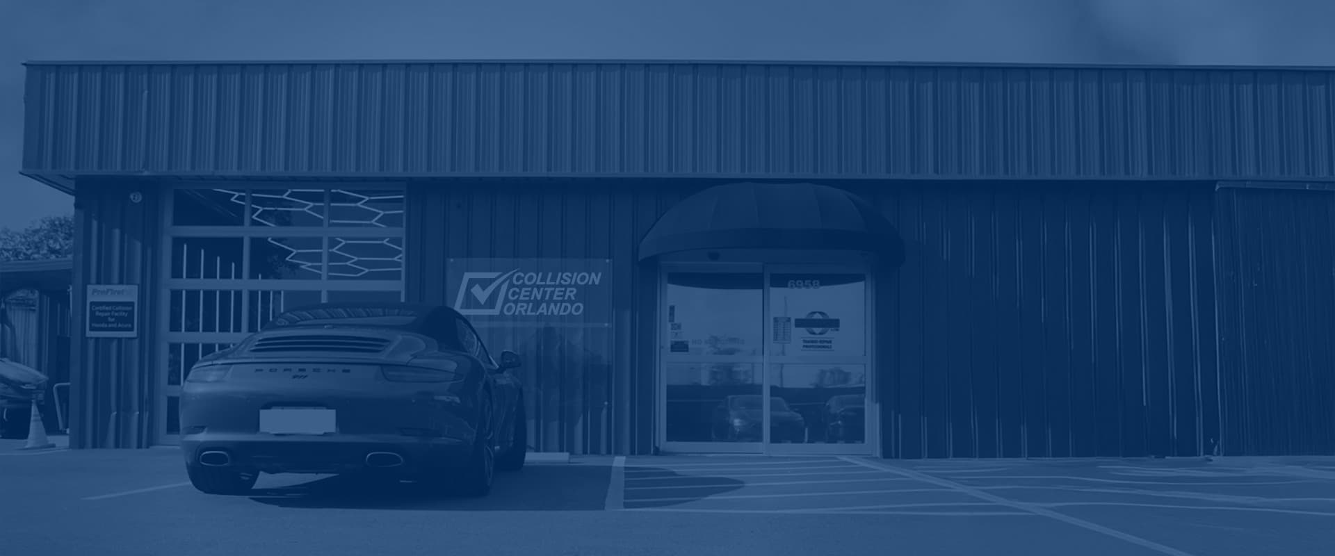 Collision Center Orlando technicians and customer vehicles outside the Orlando facility