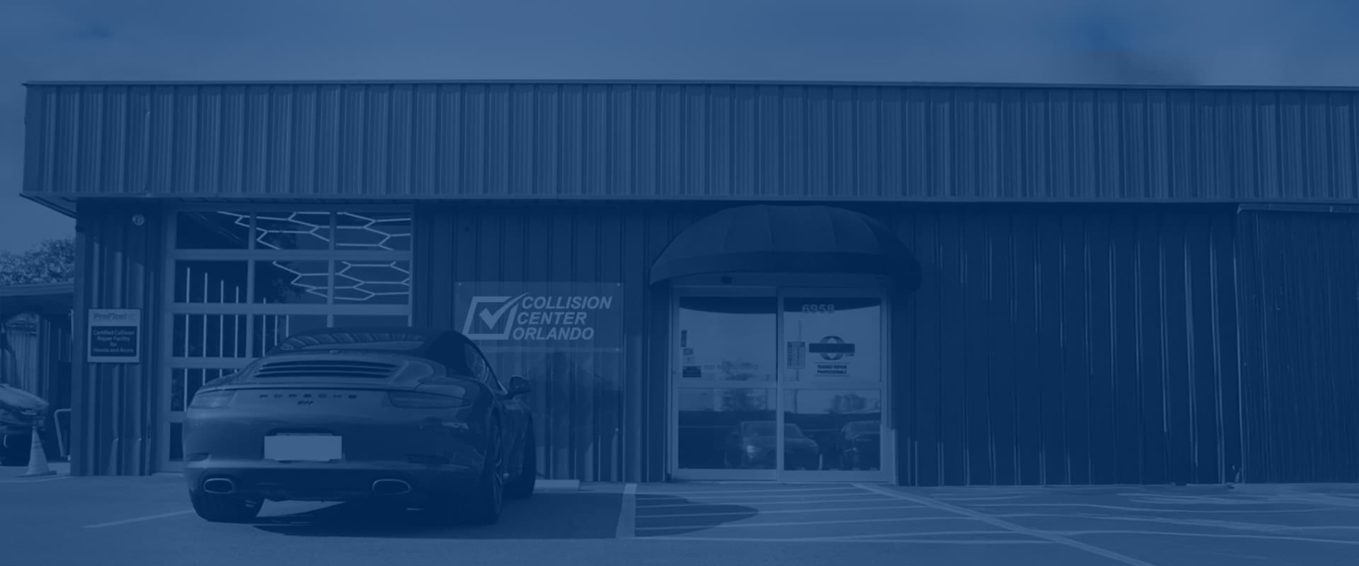 Vehicles being staged for collision repair outside the Collision Center Orlando shop